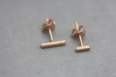 Earrings Asymmetrical line stud earrings in rose gold finish