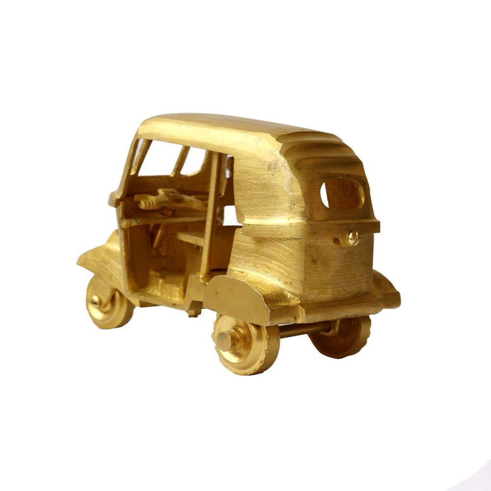 https://www.discovered.us/cdn/shop/products/pure-brass-tuk-classic-vintage-auto-rickshaw-gold-ornament-bar-decoration-handmade-de-kulture-works-discovered-692_1000x1000.jpg?v=1664551461