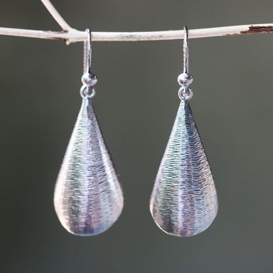 Silver leaf shape earrings with textured on oxidized sterling silver hooks style - by Metal Studio Jewelry